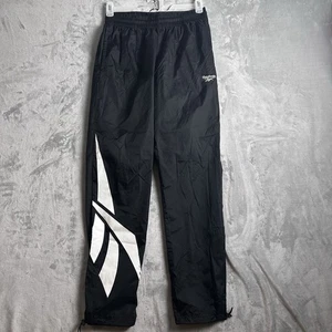 Pantalones cortavientos Reebok para hombre medianos negros de nailon estilo vintage logotipo de golpe de pierna - Imagen 1 de 15