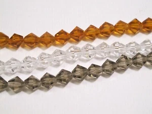 Cuentas de cristal bicono. Cuentas de cristal facetado bicono 8mm.Amarillo. Marrón. Cuentas transparentes - Imagen 1 de 7