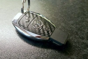 Mercedes AMG Carbon vinyl key cover with silver AMG logo sticker - Picture 1 of 2