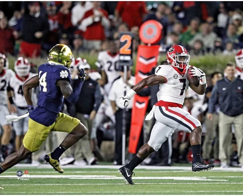 D'Andre Swift Georgia Bulldogs Unsigned Running the Ball vs Notre Dame Photo Cover