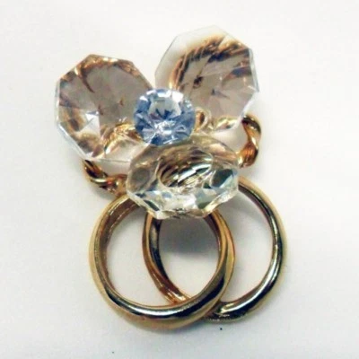 DLMBOMBONIERE 11644 Bomboniere Calamita con fedi oro o argento, fiore in cristallo e punto luc