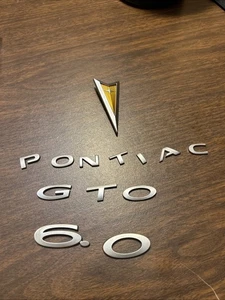 Genuine Pontiac GTO Emblem Takeoffs. Not Perfect But Nice. Oem. 2005-2006 6.0L - Bild 1 von 6