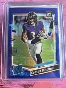 2023 Panini Donruss Optic - Rated Rookie Blue Prizm #207 Keaton Mitchell 46/199 - Bild 1 von 2