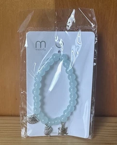Bracciale donna elasticizzato Melody perline azzurre con ciondolo conchiglia e tartaruga nuovo con etichetta - Foto 1 di 3