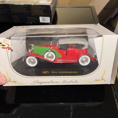 Modelos Signature 1934 Duesenberg escala 1:32 fundido a presión rojo verde nuevo sellado 1/32 Foto 1 de 3