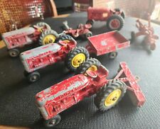 Hubley Antique Tractor 1950s-1960s Toys Set of Four With Attachments.