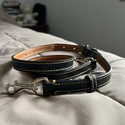 Correa de repuesto ajustable de cuero negro Dooney & Bourke para hombros Foto 1 de 3
