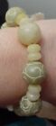 Bracelet à bascule artisanal à facettes jaunes jadéite sculpté perles jadite moyenne 