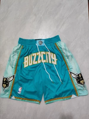 Pantalones Cortos de Baloncesto Charlotte Hornets 2024 Edición Ciudad Verde Bolsillo Foto 1 de 4