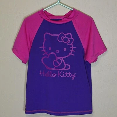 Camisa de natación Hello Kitty para niñas mediana púrpura y rosa manga corta cubierta protectora contra erupciones Foto 1 de 4