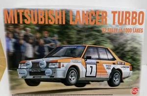 NUNU  1/24 -MITSUBISHI LANCER TURBO RALLY DEI 1000 LAGHI 1982 - 24018 - Foto 1 di 2