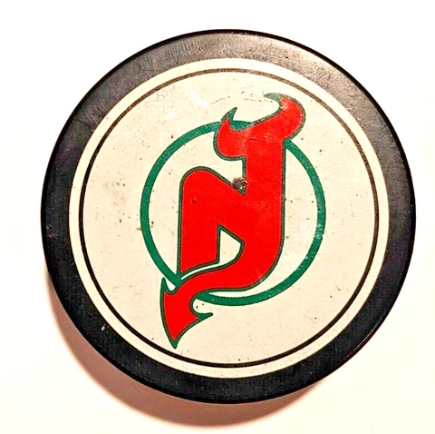 New Jersey Devils NHL Team Logo Souvenir Hockey Puck Made in Canada Cover
