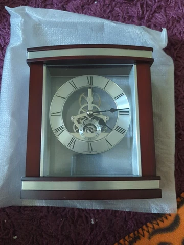 Howard Miller 645-673 Templeton Rosewood Skeleton Dial Tabletop Clock Cover