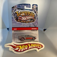 HOT WHEELS 2009 LARRY’S GARAGE HOLIDAY CAR ‘69 CHEVY CAMARO SILVER & RED W/RR.