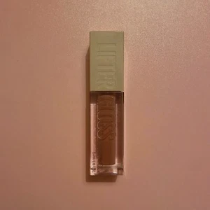 BN Maybelline Lifter Gloss Lip Plumping Gloss + Hyaluronic Acid: 004 Silk, 5.4ml - Picture 1 of 7