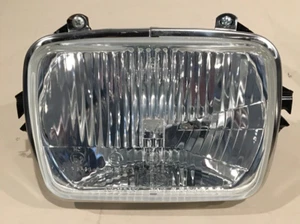 International 2013807C91 Hella 1AE 003 427-02 halogen H4/T4W headlamp. - Afbeelding 1 van 14