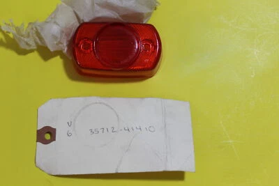 Cubierta de lente OEM# 35712-41410 NUEVO DE STOCK Suzuki DS80 PE175 PE250 DR370 77-79 Foto 1 de 4