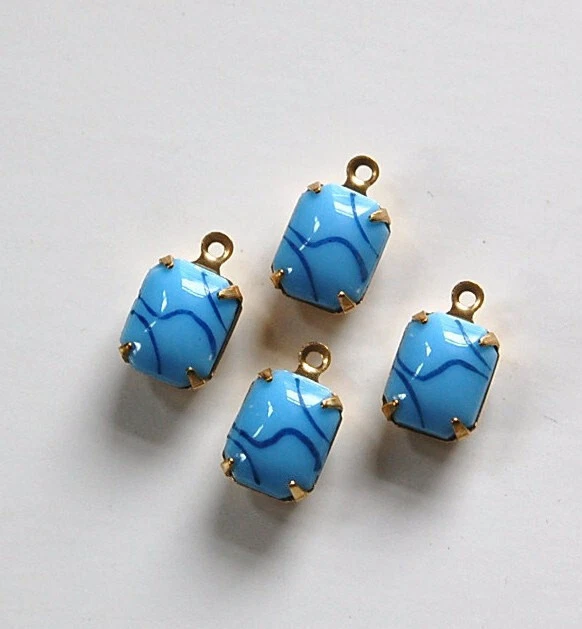 Piedras opacas azul claro de 10x8 mm con ajuste de latón azul marino de 1 lazo Foto 1 de 1