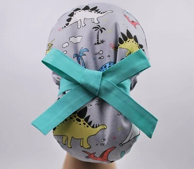 Scrub hats, nurse scrub cap, womens surgical hat, ponytail scrub cap dinosaur - Image 1 of 3