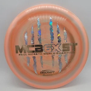 Discraft Buzzz Paul McBeth 6X McBeast Peach Swirl/Wood Grain-Money 175-176g - Picture 1 of 3