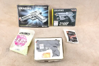 Lot of 3 Airsoft Pistols: UKARMS (2) 216AF and M757, in boxes with extra BB's - Image 1 of 4