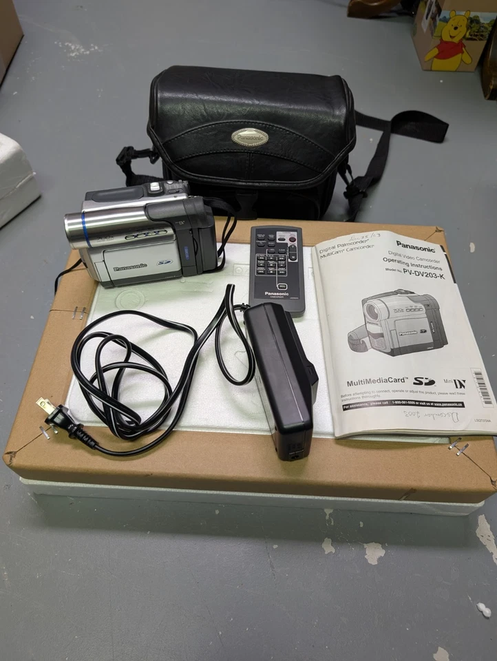 Panasonic  Digital Video Camera Charger, Bag, Remote And Instruction PV-DV203-K - Image 1 of 4