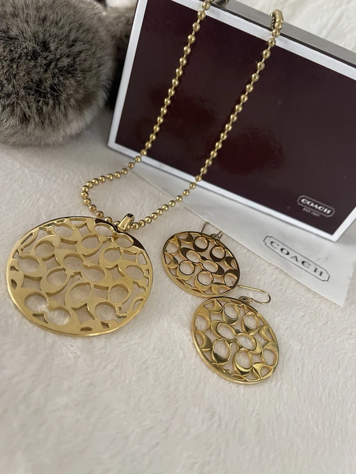 Juego de 3 collar y pendiente medallón vintage Coach Signature Foto 1 de 4