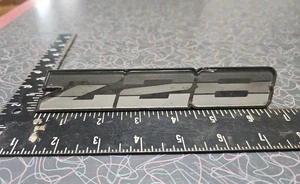 Chevy OEM 1982-1987 Camaro Z28 Grey Rocker Emblem Badge Nameplate GM 20313783 - Picture 1 of 12
