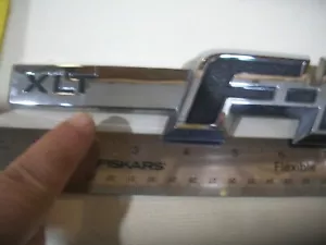 FORD F150 XLT CROMO EMBLEMA GUARDABARROS INSIGNIA OEM USADO DE FÁBRICA - Imagen 1 de 2