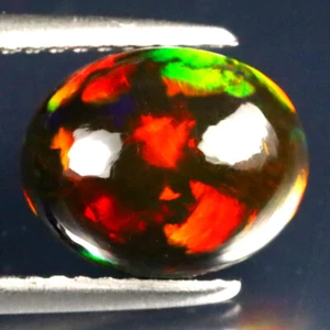 Excelente cabujón ovalado de 2,20 quilates (10 x 8 mm) ópalo negro intermitente etíope - Imagen 1 de 2