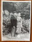 Affectionate gentle man with a girl in the park. Vintage photo