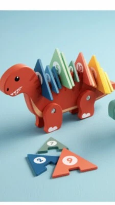 ¡Rompecabezas de aprendizaje de dinosaurio naranja de madera Mudpie! Lindo - Calidad - ¡Diversión!  Sellado de fábrica. Foto 1 de 4