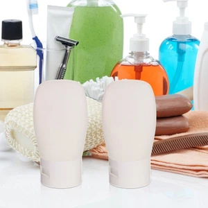 Juego de 4 piezas de champú y gel de ducha botellas vacías de viaje artículos de tocador maquillaje pequeño - Imagen 1 de 11