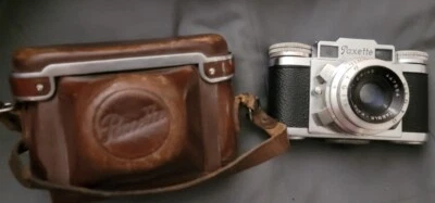 PAQUETE de cámara Braun Paxette 35 mm vintage con estuche, telémetro, lente y complementos Foto 1 de 4