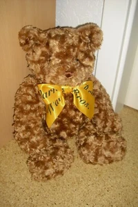 brauner  Teddybär mit Kuschelfell und einer gelben Schleife - Bild 1 von 1