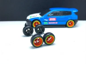 R020 Hot Wheels 1/64 Real Riders Set Donut 4 Speichen orange 10mm Langachse Gummi - Bild 1 von 5