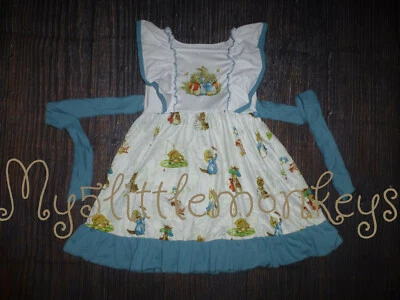 全新 Boutique Peter Rabbit 无袖女孩荷叶边复活节连衣裙 — 第 1/4 张图片