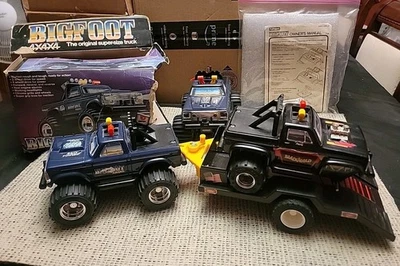 Playskool 1983 Monster Truck 4x4x4  Bigfoot(2x) & BlackGold Trailer Key LOT OF 4 - Image 1 of 4