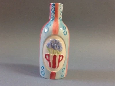 Un precioso florero de cerámica azul y rosa  Foto 1 de 2