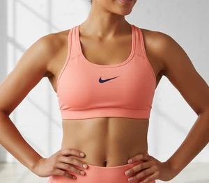 Sujetador deportivo Nike Dri-Fit rosa coral brillante para mujer talla mediana deportivo gimnasio - Imagen 1 de 7