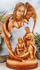 Sculpture en bois de l'ange Ebros Gabriel veillant sur la Sainte Famille de Jésus