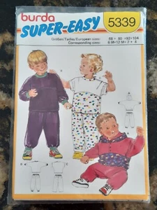 BURDA PATTERN - 5339 BABY BOY GIRL TOP KIMONO HOODIE PANTS T-SHIRT 6m-4 UNCUT - Picture 1 of 2