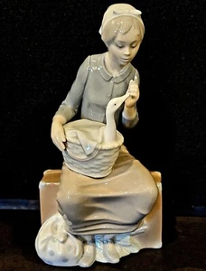 NAO GIRL SITTING ON TRUNK WITH GOOSE IN BASKET FIGURINE 10 1/2" SPAIN - Picture 1 of 6