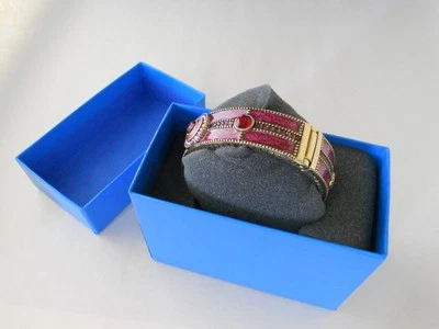 Brazalete con bisagras Heidi Daus pedrería roja y aurora boreal + caja original Foto 1 de 4