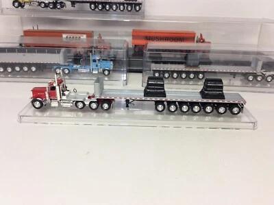 DCP Peterbilt con remolque de plataforma plana de 7 ejes con bobinas de acero. Usado fuera de paquete. Foto 1 de 4