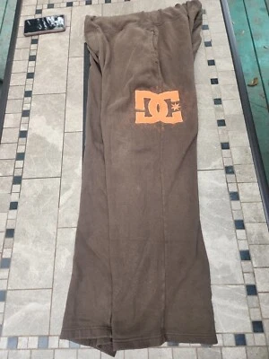 Pantalones deportivos vintage DC Shoes marrón y naranja pequeño agujero por bolsillo medianos para hombre Foto 1 de 4