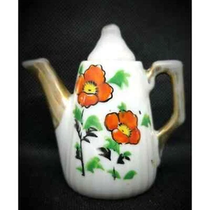 Tetera miniatura de porcelana vintage mini naranja blanco flor tetera sin marca MCM - Imagen 1 de 10