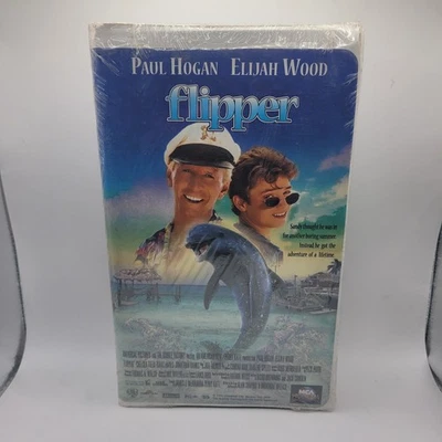 Universal Flipper Paul Hogan Elijah Wood VHS Clam Shell Case New Factory Sealed - Image 1 of 4