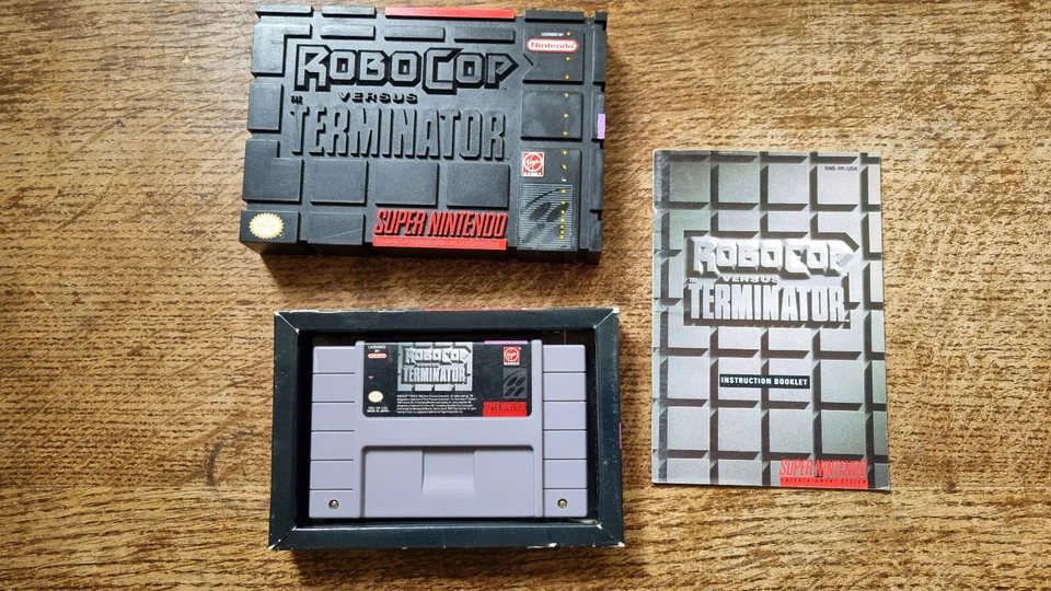SNES SUPER NINTENDO ROBOCOP VS THE TERMINATOR HARD PLASTIC CASE SPC USA NTSC CIB - Image 1 of 4