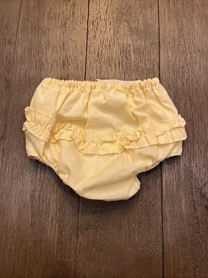 Florers vintage amarillos con volantes forrados de plástico Foto 1 de 4